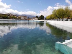 a large body of water with buildings and trees at Cueva El Madrono in Pegalajar +8 photos
