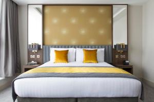 Voodi või voodid majutusasutuse Iveagh Garden Hotel toas