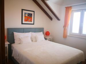 מיטה או מיטות בחדר ב-Apartment Maria Di