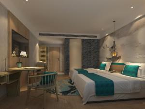 a hotel room with two beds and a desk at Guangzhou Feili International Hotel in Guangzhou +8 photos