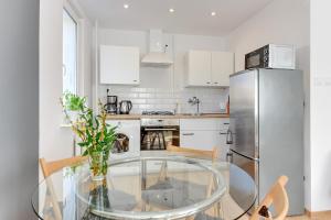 Kuchyňa alebo kuchynka v ubytovaní Gdańsk Comfort Apartments Wejhera + 6 fotografií