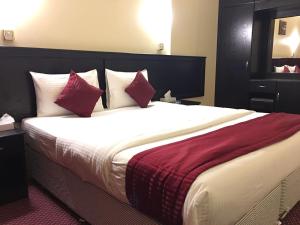 Postelja oz. postelje v sobi nastanitve Simba Hotel