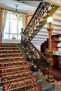a staircase leading up to a balcony with a large number of staircases at Hotel Royal in Gothenburg