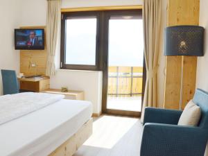 TV a/nebo společenská místnost v ubytování Hotel Karin