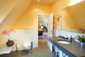 a bathroom with a sink and a mirror at Hotel Zur Alten Brücke in Heidelberg +258 photos