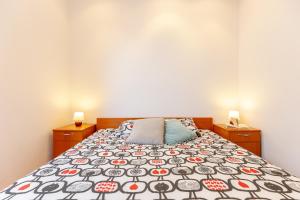 Postel nebo postele na pokoji v ubytování Apartments Mondo