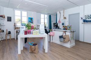 a room with a white table with bags on it at Thalacap Île de Ré - Thalasso & Spa in Ars-en-Ré