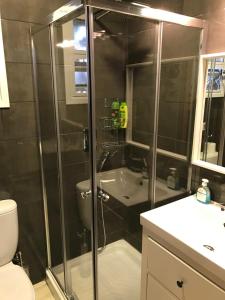 a bathroom with a shower with a toilet and a sink at Luxury Studio Ayia Napa Center in Ayia Napa +18 photos