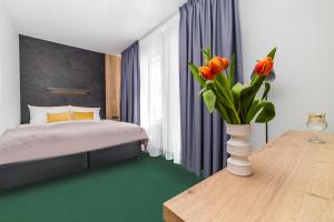 Posteľ alebo postele v izbe v ubytovaní Apartamenty PORTO