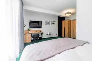 Posteľ alebo postele v izbe v ubytovaní Apartamenty PORTO