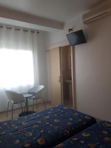 Televisyen dan/atau pusat hiburan di Hostal Margarita