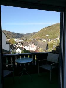 a view from a balcony with a table and chairs at Gästehaus Spies in Bullay