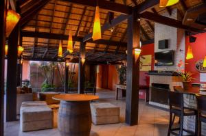 a restaurant with a table and chairs in a room at Guarita Park Hotel - By Life Hotéis in Torres