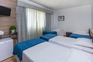 Postel nebo postele na pokoji v ubytování Hotel Torre Sol