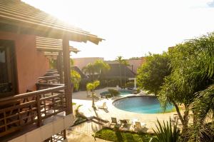 a view of a swimming pool in a yard at Guarita Park Hotel - By Life Hotéis in Torres