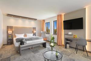 Ein Bett oder Betten in einem Zimmer der Unterkunft Hotel Krämerbrücke Erfurt
