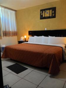 Krevet ili kreveti u jedinici u okviru objekta Hotel Suite Azomali