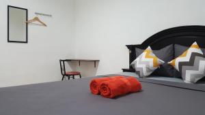Postel nebo postele na pokoji v ubytování MADOR Malang Dorm Hostel