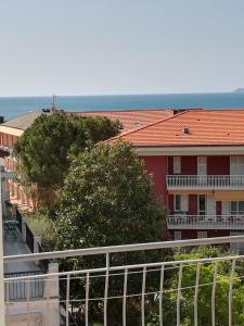 a view from a balcony of a red building at Albergo Calcagno in Borgio Verezzi