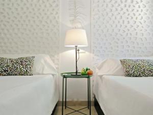 Ein Bett oder Betten in einem Zimmer der Unterkunft BizFlats Garden House