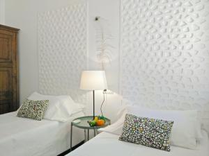 Ein Bett oder Betten in einem Zimmer der Unterkunft BizFlats Garden House
