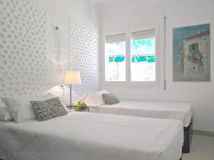Ein Bett oder Betten in einem Zimmer der Unterkunft BizFlats Garden House