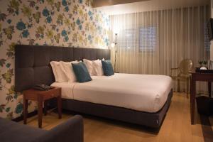 Katil atau katil-katil dalam bilik di Belem Hotel