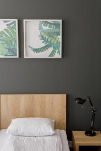 Postel nebo postele na pokoji v ubytování Arhiv Boutique House