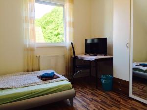 Ένα ή περισσότερα κρεβάτια σε δωμάτιο στο Gästehaus Am Linus