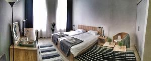 Postel nebo postele na pokoji v ubytování Arhiv Boutique House