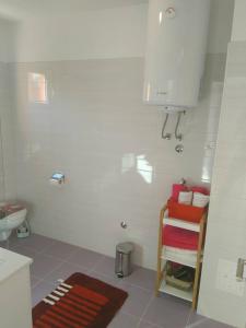 a bathroom with a sink and a towel rack at Apartment Luzia in Banjole