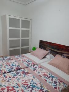 Postel nebo postele na pokoji v ubytování Casa Pueblo Alzira No Compartida