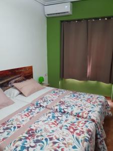 Postel nebo postele na pokoji v ubytování Casa Pueblo Alzira No Compartida