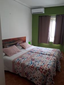 Postel nebo postele na pokoji v ubytování Casa Pueblo Alzira No Compartida