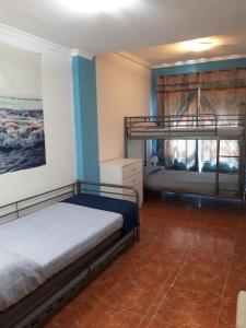 Postel nebo postele na pokoji v ubytování Casa Pueblo Alzira No Compartida