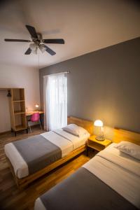 Postel nebo postele na pokoji v ubytování Hostal Tres Central