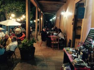 a group of people sitting at tables in a restaurant at Hotel Parador Vichuquen in Vichuquén +23 photos
