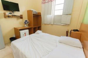 Cama o camas de una habitación en Guanabara Hotel Centro Belo Horizonte