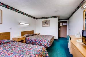 Postel nebo postele na pokoji v ubytování Motel 9