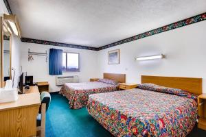 Postel nebo postele na pokoji v ubytování Motel 9