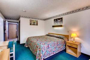 Postel nebo postele na pokoji v ubytování Motel 9
