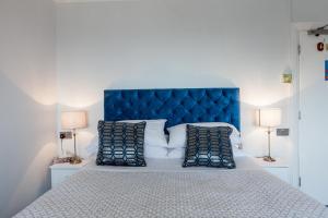 Cama o camas de una habitación en Fern Lodge Guesthouse