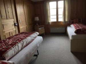 Llit o llits en una habitació de Appartement Fernsicht Triesenberg