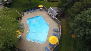 an overhead view of a swimming pool with umbrellas at Ship's Knees Inn in East Orleans