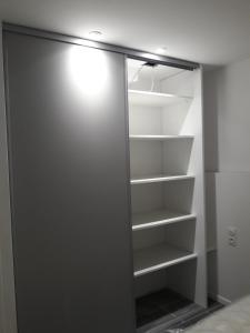 a walk in closet with a glass door at Magnifique Appartement CAP NATURISTE in Cap d'Agde +12 photos