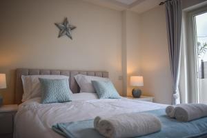 Ένα ή περισσότερα κρεβάτια σε δωμάτιο στο Blue View House