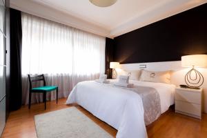 Postel nebo postele na pokoji v ubytování The Queen Luxury Apartments - Villa Serena