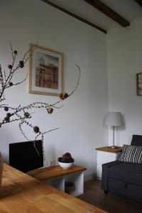 a living room with a tree branch on the wall at Eguzkilorea in Hondarribia