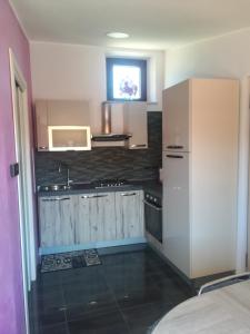 a kitchen with a sink and a counter at Attico Sole Luna in Taormina +32 photos