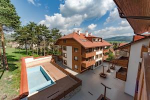an aerial view of a house with a swimming pool at Veli Hills Apartments in Velingrad